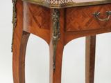 a small table with a drawer on top of it