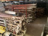a large pile of pipes and pipes in a warehouse