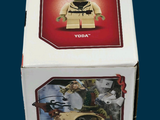 a box that has a lego star wars yodak figure in it