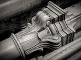 a close up of a decorative object on the side of a building