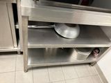 a pot and pan sitting on a shelf in a kitchen