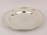a silver plate on a white background with a silver handle
