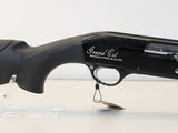 a close up of a shotgun with a small hook on it