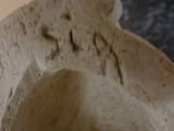 a close up of a stone sculpture of a bear