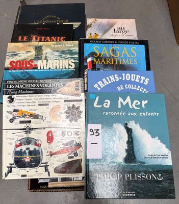 several books are stacked on top of each other on the floor