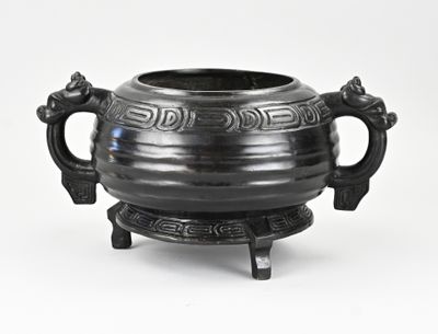 a black pot with handles on a stand on a white background