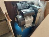 a box with a blue air compressor in it