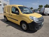 the yellow van is parked in a parking lot near other cars