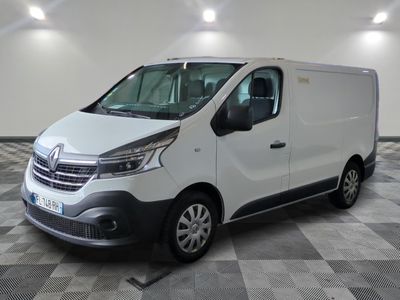 the white van is parked on a checkered floor in a room