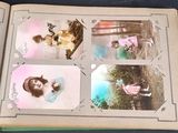 an open book with a picture of a little girl on it