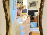 a mirror hanging on a wall in a room