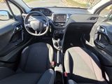the interior of a small car with a steering wheel and dashboard