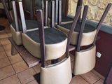 four chairs that are sitting in front of a table