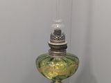 a glass lamp that is sitting on a table