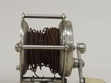 a reel that is sitting on a white surface