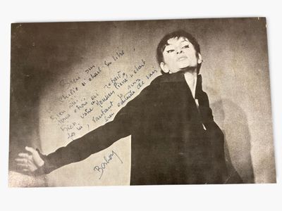an old photo of a man in a suit with a handwritten message