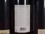 three bottles of wine sitting on a table