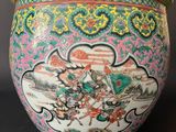 an image of a vase with a painting on it sitting on a table