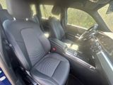 the interior of a car with black leather seats and a steering wheel