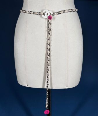 a close up of a mannequin torso with a chain around it