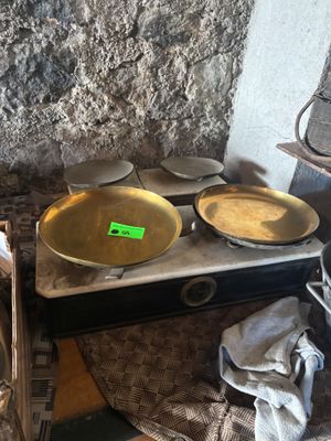 pots and pans are sitting on a stove in a kitchen