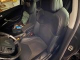 a picture of the inside of a car with the door open