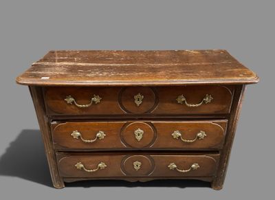 an old wooden chest of drawers with brass handles