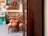 a tall wooden cabinet in the corner of a room