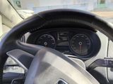 dashboard view of a car with a steering wheel and gauges