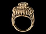an image of a gold ring with a flower on it