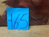 a blue piece of paper with the number 65 on it