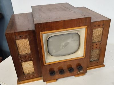 an old television sitting on top of a table
