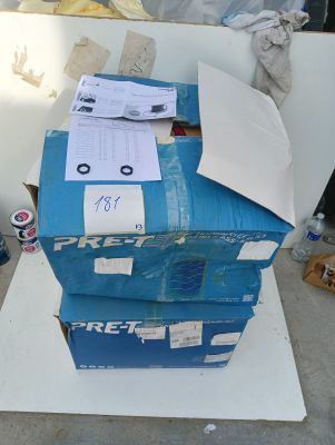 a stack of boxes sitting on top of a white table
