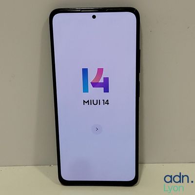 a close up of a cell phone with the number 14 on it