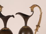 two vases that are sitting next to each other