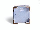 a small blue box that has a sticker on it
