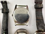 several different types of watches are displayed on a white surface