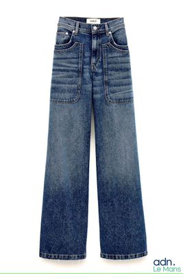 the jeans are blue and have buttons on the side of them
