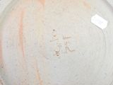 an image of a bowl with a tag on it
