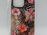 a close up of a cell phone case with flowers and zebras