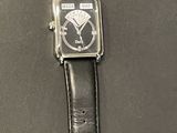 an image of a close up of a wrist watch on a table