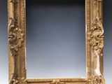 a picture of a gold picture frame on a table