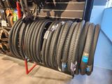 a lot of tires on a rack in a store