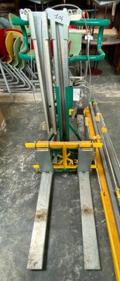 a picture of a fork lifter in a warehouse