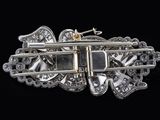 an image of a silver and diamond broochle on a black background