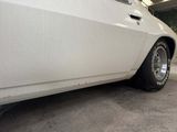 a white car that is parked in a garage