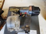 a picture of a corded nail gun on a piece of metal