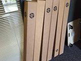 several cardboard boxes are stacked on top of each other in front of a window