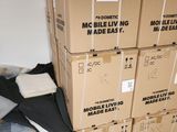 many boxes stacked on top of each other in a room