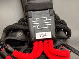 a black backpack with a red rope attached to it